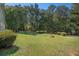 Expansive backyard showcasing a well-manicured lawn and beautiful, mature trees at 5623 Yeager Dr, Douglasville, GA 30135