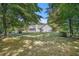 Lush backyard featuring a well-maintained lawn and a mix of open space and mature trees at 5623 Yeager Dr, Douglasville, GA 30135