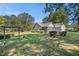 Serene backyard view featuring a lush lawn and mature trees, perfect for outdoor enjoyment at 5623 Yeager Dr, Douglasville, GA 30135