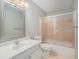 Bathroom with single sink vanity, shower over tub, and a framed mirror at 5623 Yeager Dr, Douglasville, GA 30135
