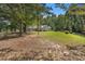A charming home situated on a large, well-manicured lawn with mature trees at 5623 Yeager Dr, Douglasville, GA 30135