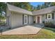 Inviting entrance with a red front door, tidy landscaping, and two car garage at 5623 Yeager Dr, Douglasville, GA 30135