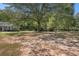 Expansive front yard with mature trees providing ample shade and natural beauty at 5623 Yeager Dr, Douglasville, GA 30135