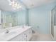 Ensuite bathroom with shower, tub, double sink vanity, and tile flooring at 5623 Yeager Dr, Douglasville, GA 30135