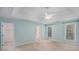 Spacious main bedroom with tray ceiling, carpet floors, walk-in closet, and ensuite bathroom at 5623 Yeager Dr, Douglasville, GA 30135