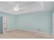 Spacious main bedroom with tray ceiling, carpet floors, walk-in closet, and ensuite bathroom at 5623 Yeager Dr, Douglasville, GA 30135