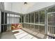Relaxing screened porch with a swing, offering a peaceful outdoor retreat at 5623 Yeager Dr, Douglasville, GA 30135