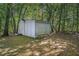 Storage shed in wooded backyard at 5623 Yeager Dr, Douglasville, GA 30135