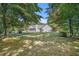 The home has a large backyard with mature trees at 5623 Yeager Ridge Dr, Douglasville, GA 30135