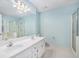 Bright bathroom featuring a double sink vanity, a shower, and a soaking tub at 5623 Yeager Ridge Dr, Douglasville, GA 30135