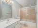 Well-lit bathroom with single sink vanity and shower-tub combo at 5623 Yeager Ridge Dr, Douglasville, GA 30135