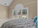 Bright bedroom with tray ceiling and private access to the outdoor living area at 168 Jersey Rd, Oxford, GA 30054