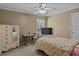 Bedroom with a ceiling fan, closet, television and a writing desk with chair at 168 Jersey Rd, Oxford, GA 30054