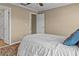 Bedroom with a queen size bed, wood flooring, and a view to an adjacent room at 168 Jersey Rd, Oxford, GA 30054
