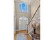 Grand foyer with a soaring ceiling, large windows, and staircase at 168 Jersey Rd, Oxford, GA 30054