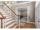 Stunning foyer showcasing a staircase and view of an office space at 168 Jersey Rd, Oxford, GA 30054