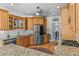 Bright kitchen with stainless steel appliances, granite countertops and white tile backsplash at 168 Jersey Rd, Oxford, GA 30054