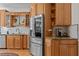 Bright kitchen with stainless steel appliances, granite countertops and wood cabinets at 168 Jersey Rd, Oxford, GA 30054