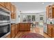 Bright kitchen with breakfast nook, stainless steel appliances, granite countertops and wood cabinets at 168 Jersey Rd, Oxford, GA 30054
