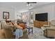 Open-concept living room with hardwood floors, a TV, and comfortable seating at 168 Jersey Rd, Oxford, GA 30054