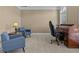 Cozy home office with comfortable seating, desk, and natural light at 168 Jersey Rd, Oxford, GA 30054
