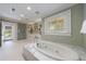 Large bathroom featuring a soaking tub and natural light at 202 Lakeview Ave, Atlanta, GA 30305