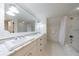 Bathroom features double sinks with marble countertop, shower with tile surround, and sleek fixtures at 202 Lakeview Ave, Atlanta, GA 30305