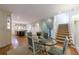 Open-concept dining area with hardwood floors seamlessly connecting the kitchen, dining, and living spaces at 202 Lakeview Ave, Atlanta, GA 30305