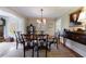 Traditional dining room with classic decor, chandelier, and a large portrait on the wall at 202 Lakeview Ave, Atlanta, GA 30305
