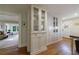 Elegant dining room featuring built-in glass cabinetry and hardwood floors, perfect for entertaining at 202 Lakeview Ave, Atlanta, GA 30305