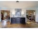 Welcoming foyer featuring hardwood floors, a dark wood credenza, and neutral decor leading to other rooms at 202 Lakeview Ave, Atlanta, GA 30305