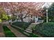 Beautiful home entrance with stone steps, landscaped garden beds, and a blooming tree at 202 Lakeview Ave, Atlanta, GA 30305