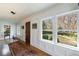 Bright hallway featuring paneled walls, hardwood floors, and natural light from large windows at 202 Lakeview Ave, Atlanta, GA 30305