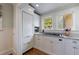 Bright kitchen featuring stainless steel appliances, granite counters, and custom cabinets at 202 Lakeview Ave, Atlanta, GA 30305