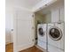 Laundry room features washer and dryer, storage cabinets, and easy access to other areas of the home at 202 Lakeview Ave, Atlanta, GA 30305