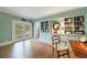 Living room featuring hardwood floors, built-in shelving, and a light blue color scheme at 202 Lakeview Ave, Atlanta, GA 30305