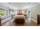 Spacious bedroom with hardwood floors, window seats and stylish decor at 202 Lakeview Ave, Atlanta, GA 30305