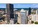 Stunning aerial view shows off stadium with city skyline and lush greenery beyond at 32 Peachtree Nw St # 1303, Atlanta, GA 30303