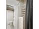 Bathroom connected to open closet with built-in shelving for optimal storage and organization at 32 Peachtree Nw St # 1303, Atlanta, GA 30303