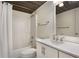 Bathroom features a shower, a vanity with modern faucet, and dark wood ceiling at 32 Peachtree Nw St # 1303, Atlanta, GA 30303