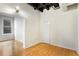 Bedroom showcasing hardwood floors, a closet, and a view into another room at 32 Peachtree Nw St # 1303, Atlanta, GA 30303