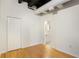 Bright bedroom with hardwood floors and an adjacent bathroom with modern fixtures at 32 Peachtree Nw St # 1303, Atlanta, GA 30303