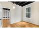 Bedroom with hardwood floors and a doorway leading to a living room at 32 Peachtree Nw St # 1303, Atlanta, GA 30303
