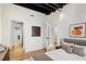 Bedroom with hardwood floors, modern decor and a view of the adjacent bathroom at 32 Peachtree Nw St # 1303, Atlanta, GA 30303