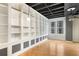 Bedroom with built in white shelving, modern lighting, and wood floors at 32 Peachtree Nw St # 1303, Atlanta, GA 30303