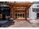 An ornate building entrance with decorative gold accents, planters, and historical signage at 32 Peachtree Nw St # 1303, Atlanta, GA 30303