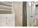 Custom closet featuring built-in shelving and space for storing wardrobe and accessories at 32 Peachtree Nw St # 1303, Atlanta, GA 30303