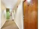 Hallway with carpeted floor, neutral walls, and a door with a unit number 1303 at 32 Peachtree Nw St # 1303, Atlanta, GA 30303