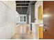 View of interior showing hardwood floors, black ceiling beams and built-in shelving at 32 Peachtree Nw St # 1303, Atlanta, GA 30303