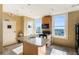 Well-lit kitchen features granite countertops and natural light with views of the city at 32 Peachtree Nw St # 1303, Atlanta, GA 30303